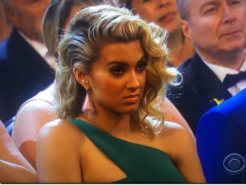 Tori Kelly looks unimpressed during Taylor Swift's Grammys 2016 speech