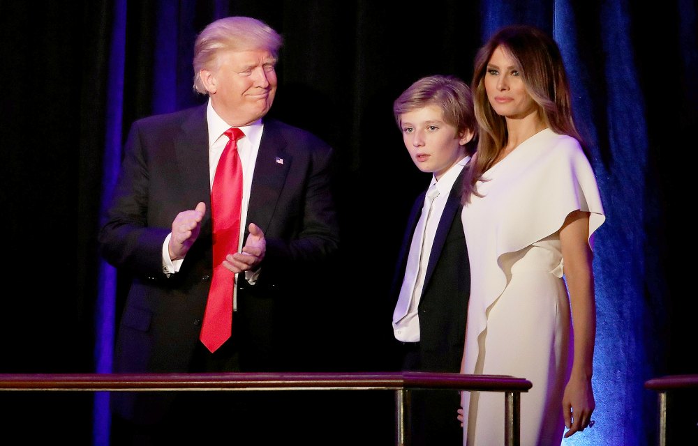 Republican president-elect Donald Trump walks on stage with his son Barron Trump and wife Melania Trump during his election night event at the New York Hilton Midtown in the early morning hours of Nov. 9, 2016, in New York City.