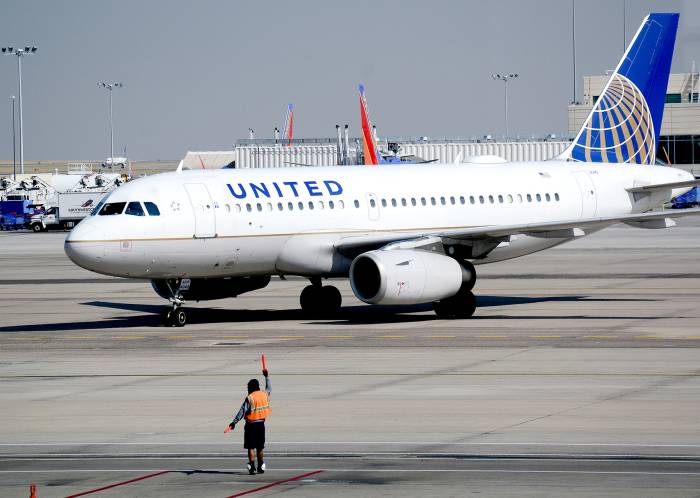 A United Airlines Airbus A319 passenger plane taxis toward a gate at Denver International Airport in Denver, Colorado.