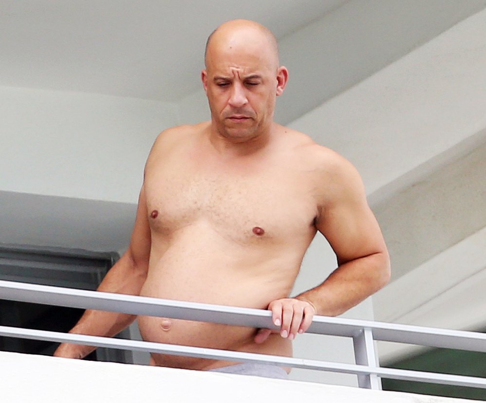 Vin Diesel on a balcony in Miami with a round stomach