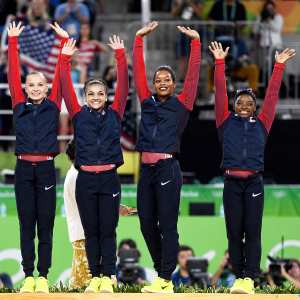 Gold Medalists Simone Biles, Gabrielle Douglas, Lauren Hernandez, Madison Kocian and Alexandra Raisman of the United States celebrate on the podium at the medal ceremony for the Artistic Gymnastics Women's Team Final on Day 4 of the Rio 2016 Olympic Games at the Rio Olympic Arena on August 9, 2016 in Rio de Janeiro, Brazil.