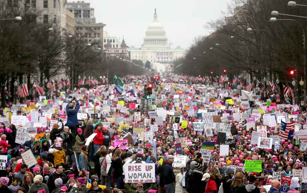 Protesters walk during the Women's March on Washington, with the U.S. Capitol in the background, on Jan. 21, 2017.